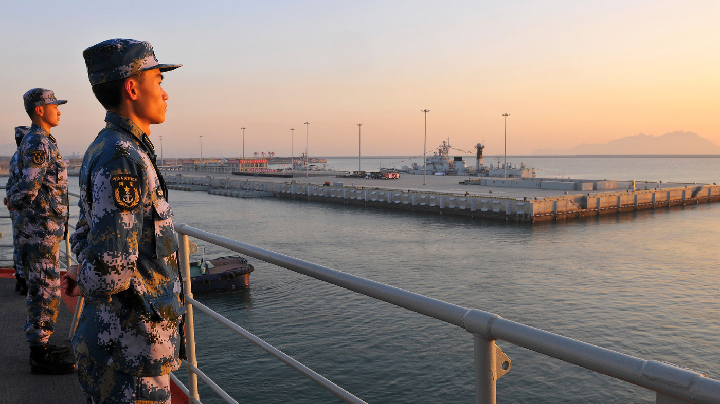Members of the Chinese navy stand guard on China's first aircraft carrier, Liaoning, in 2013. Tensions in the South China Sea have grown over territorial disputes between China, the Philippines, Japan, Vietnam and others.