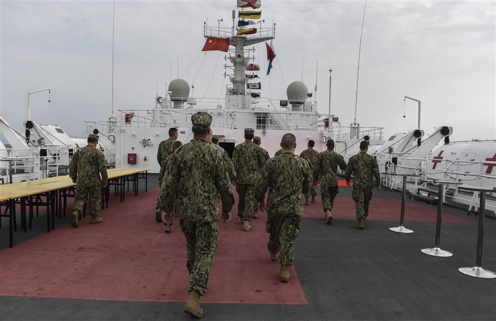 U.S. Navy Sailors assigned to Camp Lemonnier walk on the deck of the Chinese hospital ship, Ark Peace, in the Port of Djibouti, August 28, 2017. Medical personnel from Camp Lemonnier visited the Ark Peace and received a tour from Chinese medical personnel to highlight the ship’s capabilities. / China Djibouti base