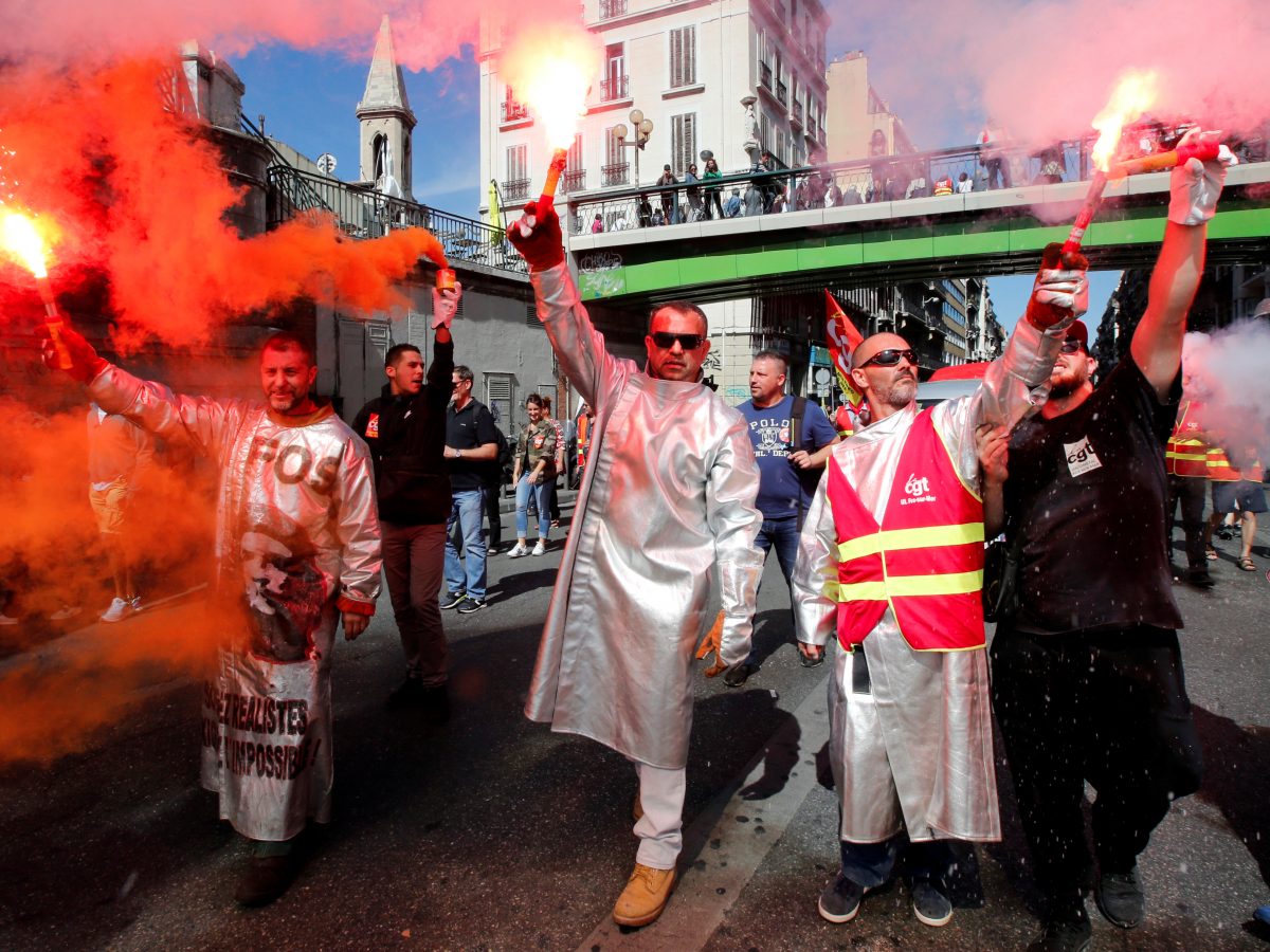 French union members light flares in Marseille