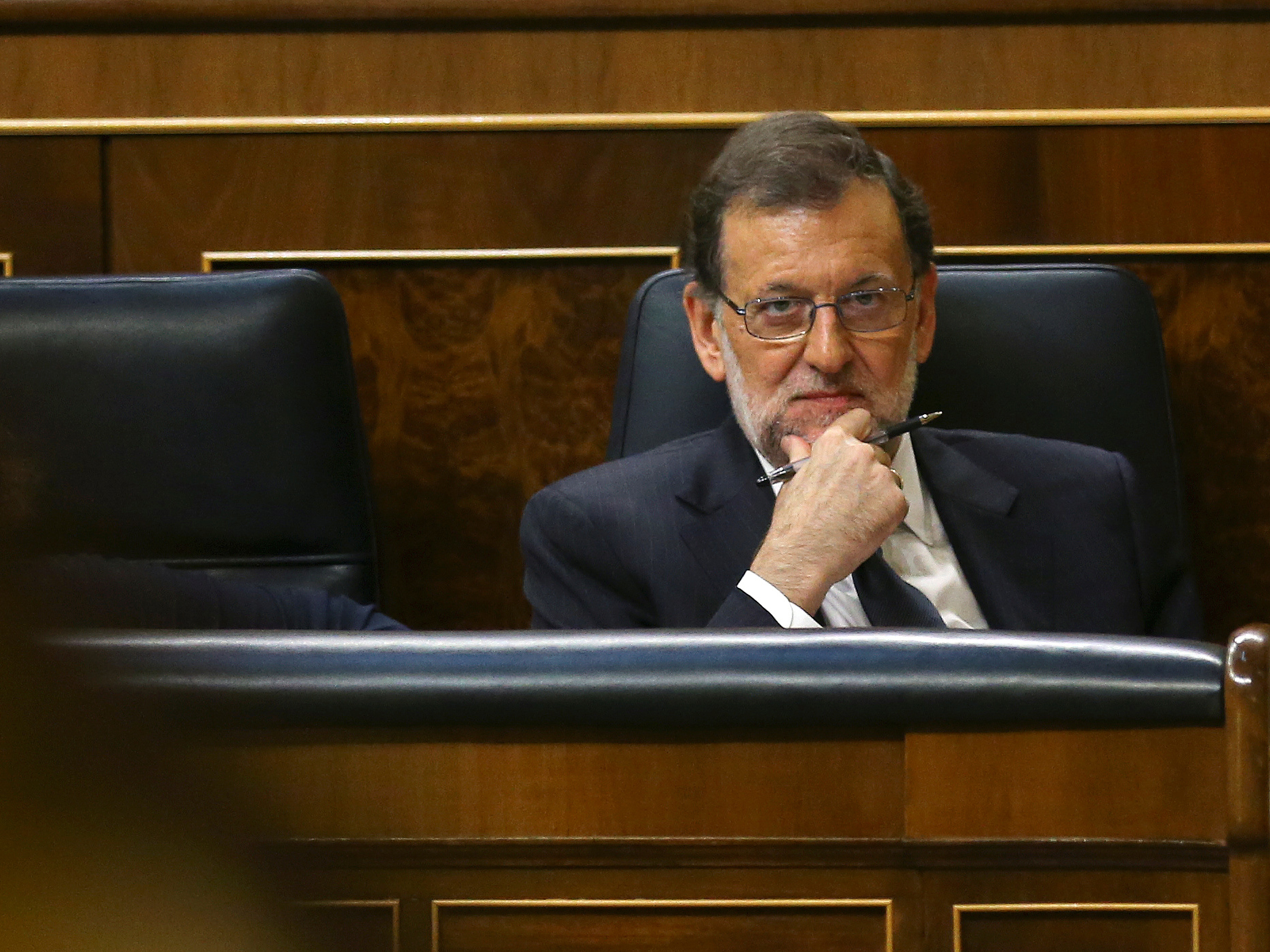Spain’s acting PM Rajoy attends the investiture debate at the Parliament in Madrid