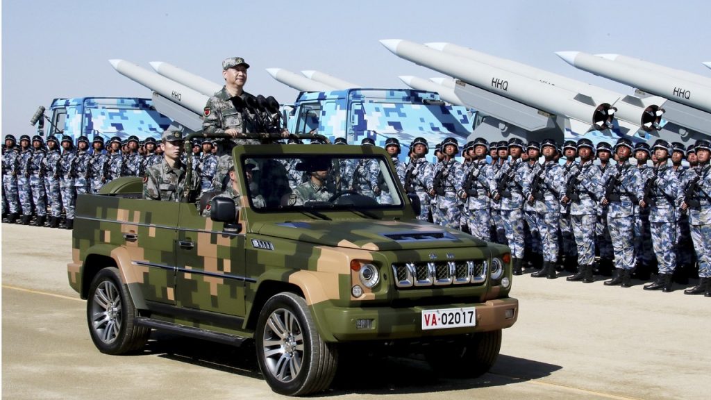 Chinese President Xi Jinping inspects troops of the PLA during a parade to commemorate the 90th anniversary of the founding of its founding.
