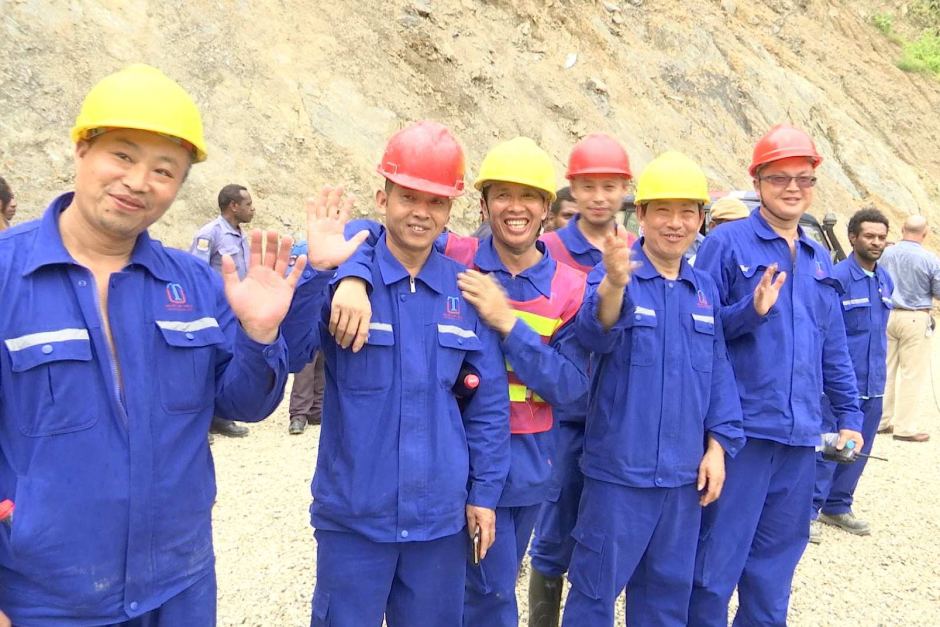 Chinese workers at the China Development Bank-funded Edevu Hydro Project site.