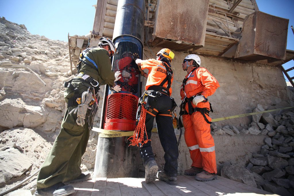 Rescue workers practice a dry run with one of the capsules that will be used to liberate the trapped miners at the San Jose mine near Copiapo, Chile on October 11, 2010.