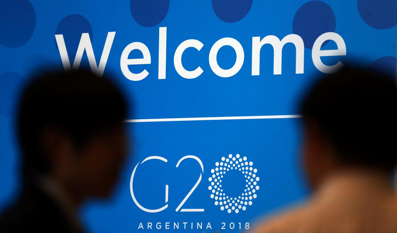 Two men talk at the G20 Meeting of Finance Ministers in Buenos Aires