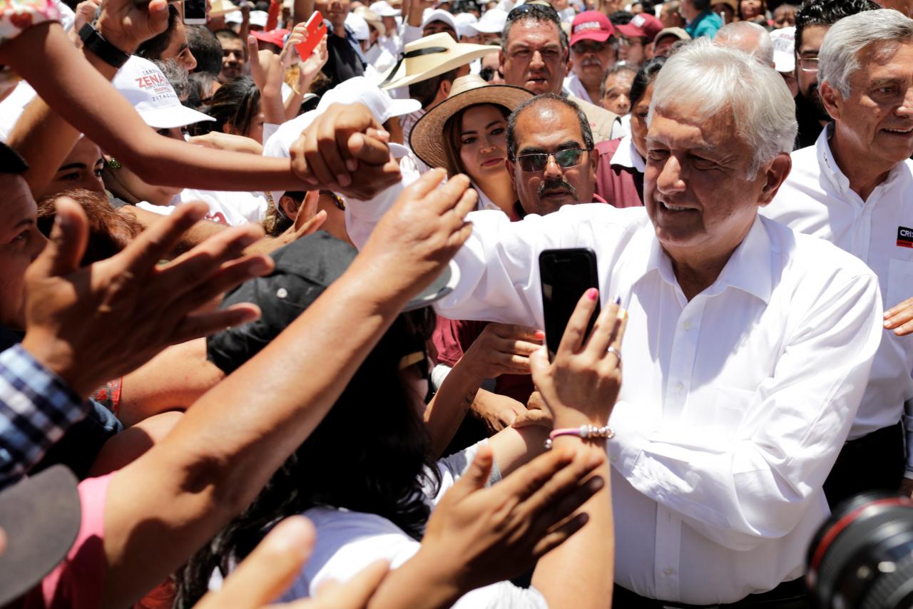 Leftist front-runner Andres Manuel Lopez Obrador of MORENA is greeted by supporters while arriving to a campaign rally in Zitacuaro