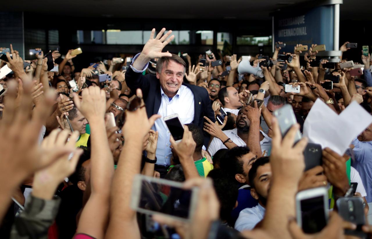 Federal deputy Jair Bolsonaro, a pre-candidate for Brazil’s presidential election, is greeted by supporters as he arrives at Luis Eduardo Magalhaes International Airport in Salvador