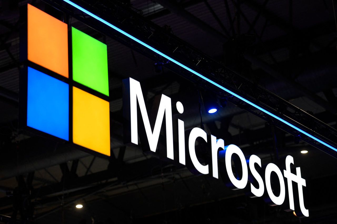 Microsoft logo shines behind dark lights