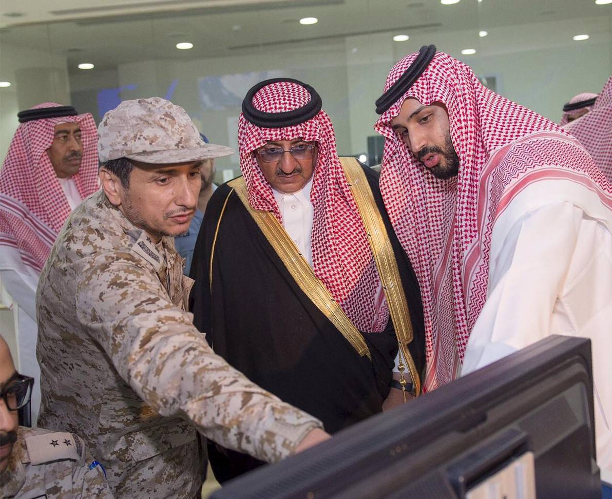 Saudi Arabia's Crown Prince, Muhammad bin Nayef, and Defence Minister Mohammad bin Salman pour over military maps 