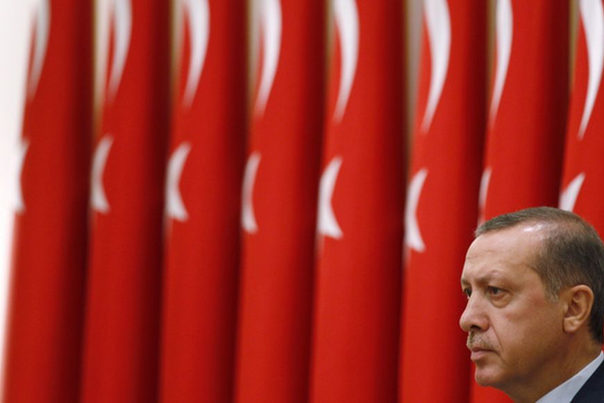 Turkey's Prime Minister Tayyip Erdogan chairs the annual meeting of the Supreme Military Council (YAS) in Ankara August 1, 2011. Erdogan has an unspoken pact with the Turkish electorate: he delivers rapid economic growth, jobs and money, and voters let him shape what kind of democracy this Muslim nation of 74 million people becomes. The prime minister's Justice and Development Party (AKP), socially conservative and successor to a banned Islamist party, won a third term with 50 percent of the vote in parliamentary elections in June thanks largely to the success of its pro-growth free-market policies. Picture taken August 1, 2011. To match Special Report TURKEY-ERDOGAN/ REUTERS/Umit Bektas/Files (TURKEY - Tags: POLITICS MILITARY)
