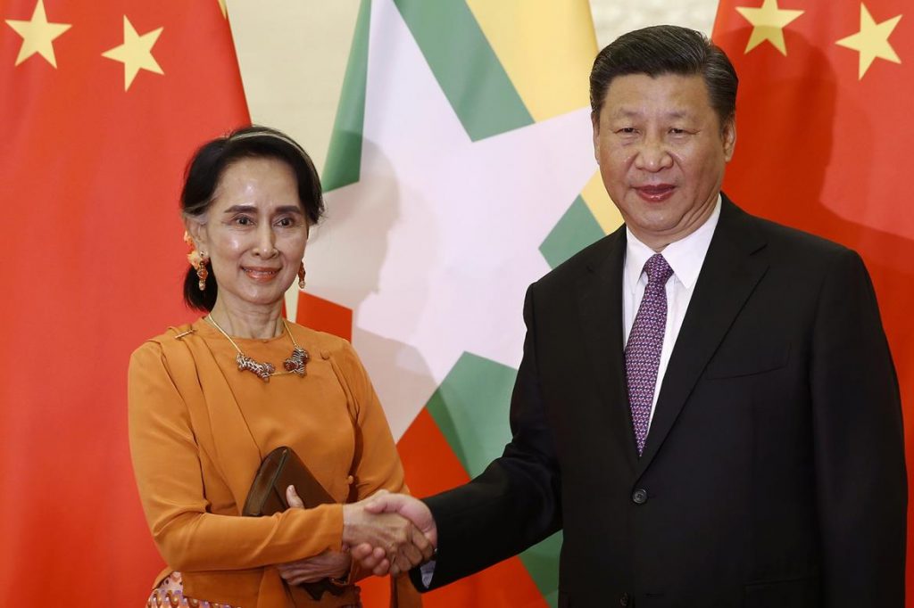 Daw Aung San Suu Kyi shakes hands with Chinese President Xi Jinping during a meeting in Beijing on May 16.