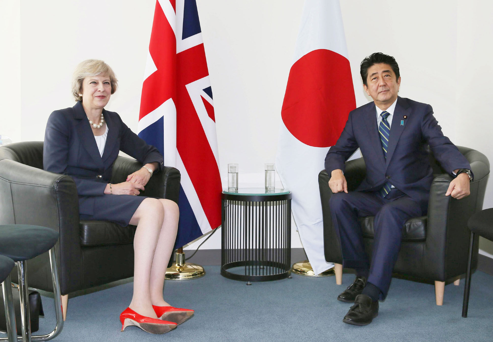 British Prime Minister Theresa May poses for a picture with Japan’s Shinzo Abe