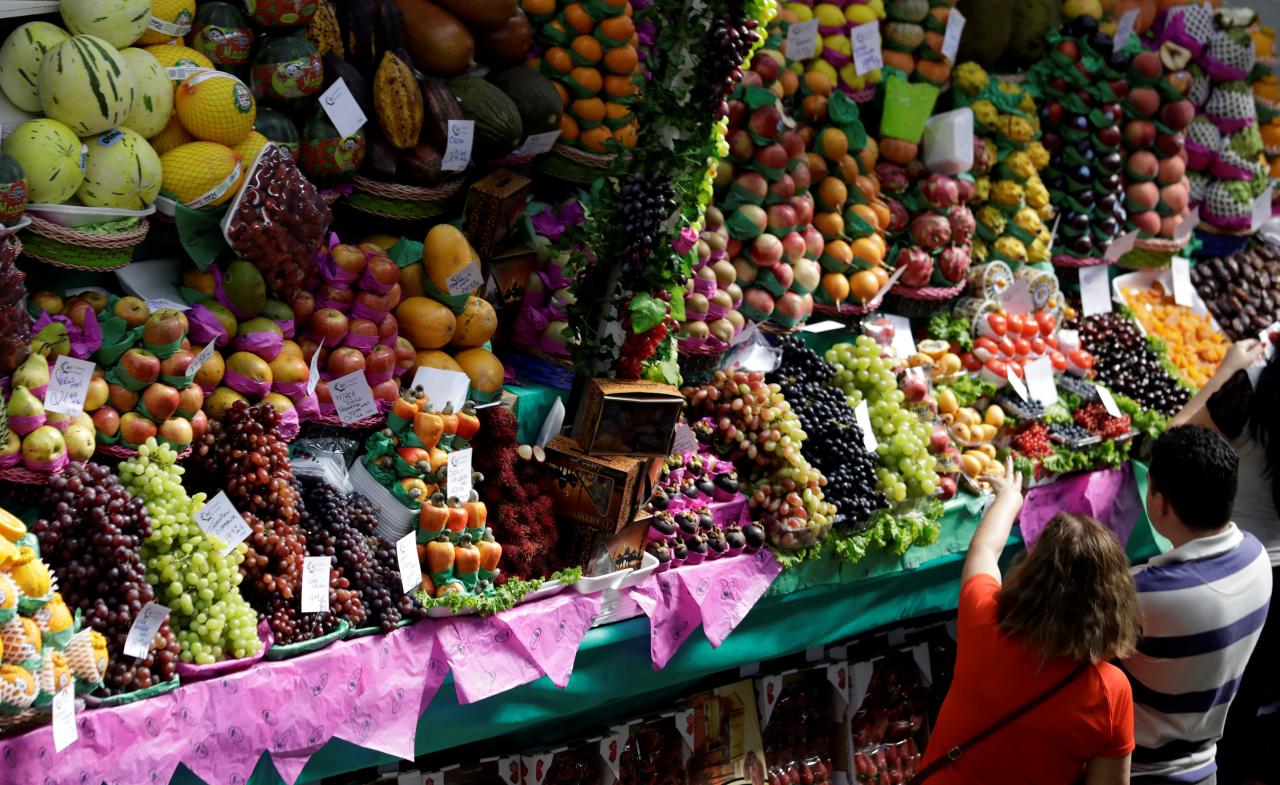 People shop at the Municipal Market of Sao Paulo in downtown Sao Paulo, Brazil