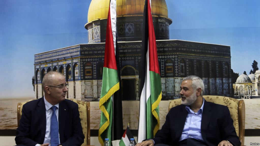 Palestinian prime minister Rami Hamdallah and senior Hamas official Ismail Haniyeh