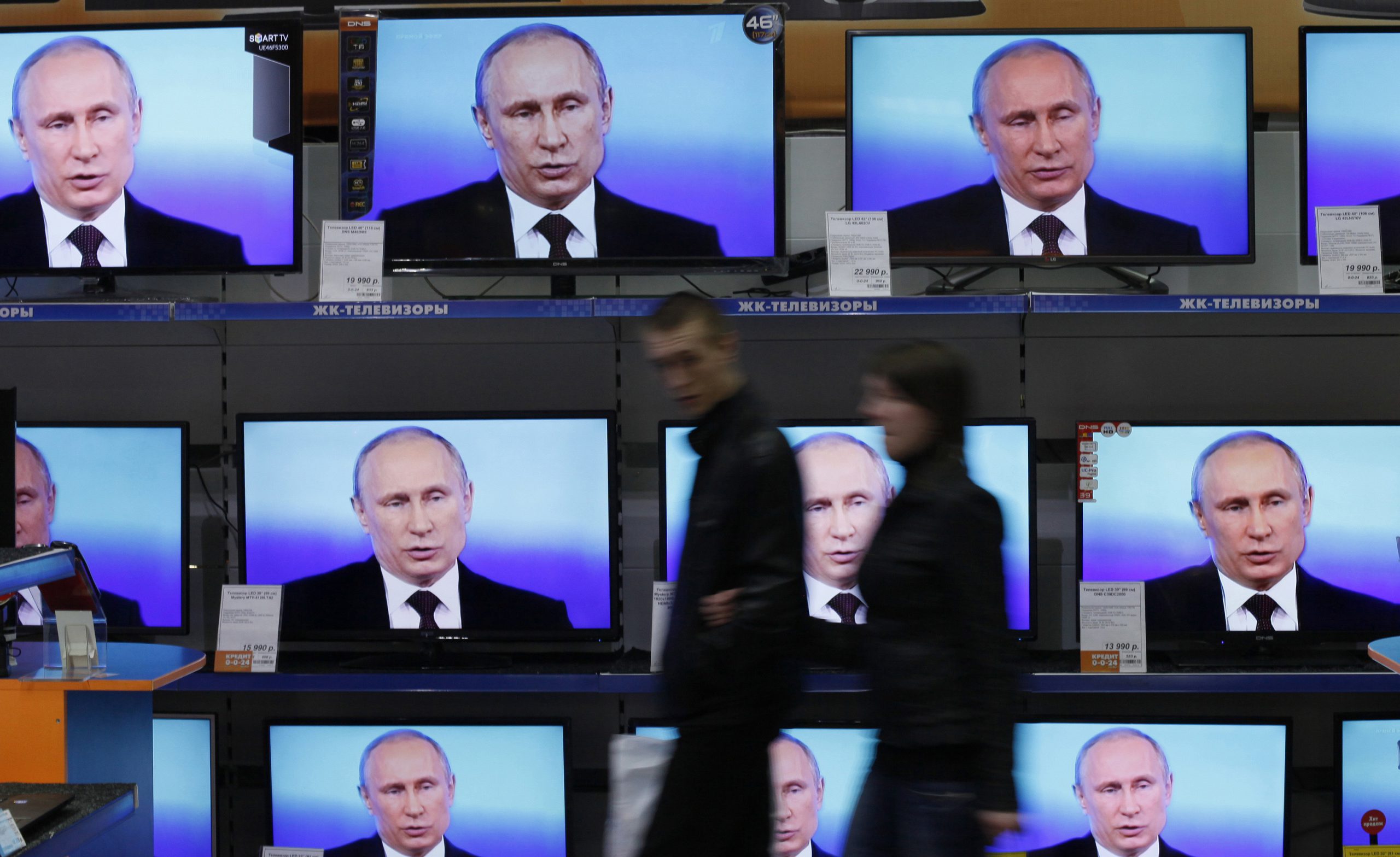 Russian President Vladimir Putin talks to the media after a live broadcast nationwide phone-in in Moscow