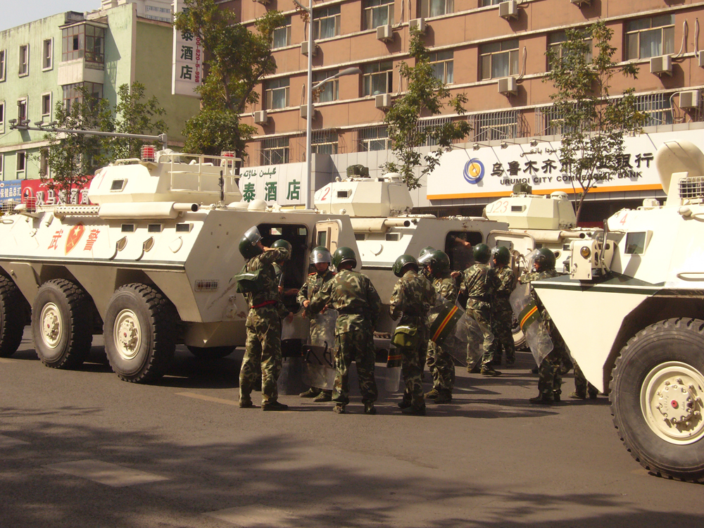 Armed Police soldiers and armored vehicles WZ551 in the street of Urumqi in September 4, 2009. Days before and at the time, tens of thousands of civilians demonstrated around major places in the city, against a series of the hypodermic needle attacks starting in mid-August.