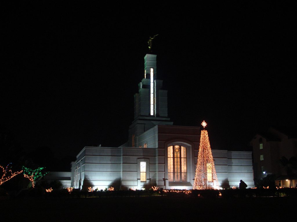 The Accra Ghana Temple at night decorated for Christmas