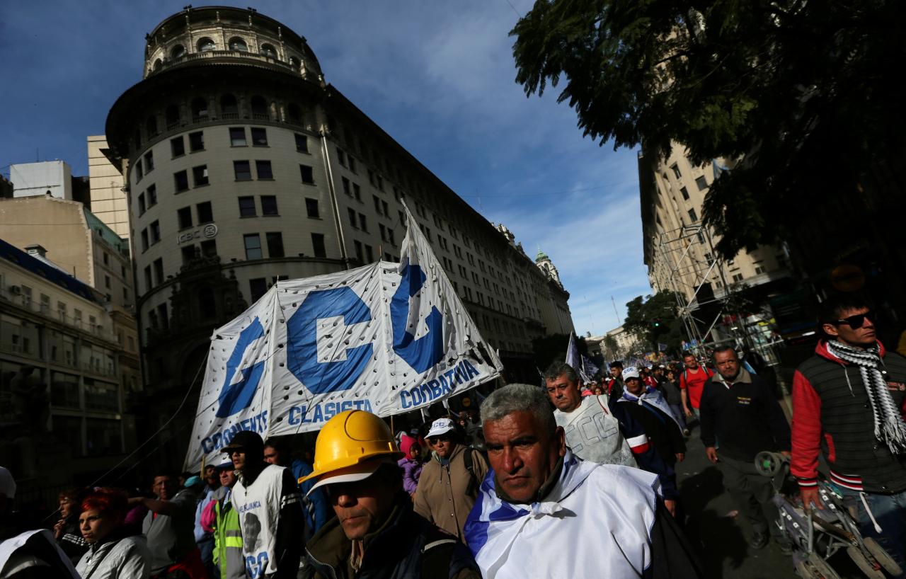 Union workers march during a demonstration against Argentine President Macri’s administration in Buenos Aires