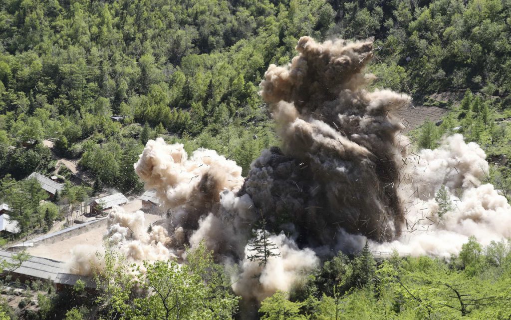 In this May 24, 2018 photo, The fourth tunnel of North Korea's nuclear test site is blown up in Punggye-ri, North Korea. North Korean leader Kim Jong Un made good on his promise to demolish his country's nuclear test site as a group of foreign journalists looked on. / Trump-Kim
