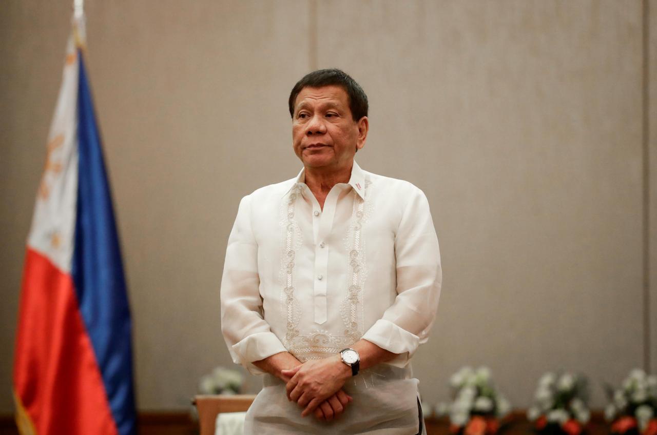 Philippines ‘President Rodrigo Duterte stands at attention during a courtesy call with the Association of Southeast Asian Nations (ASEAN) Economic Ministers in Manila