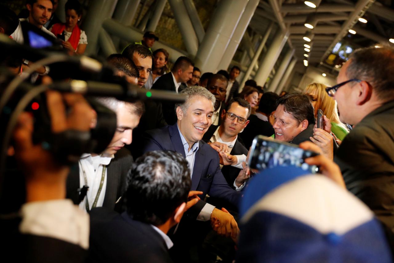 Right wing presidential candidate Ivan Duque greets supporters after polls closed in the first round of the presidential election in Bogota