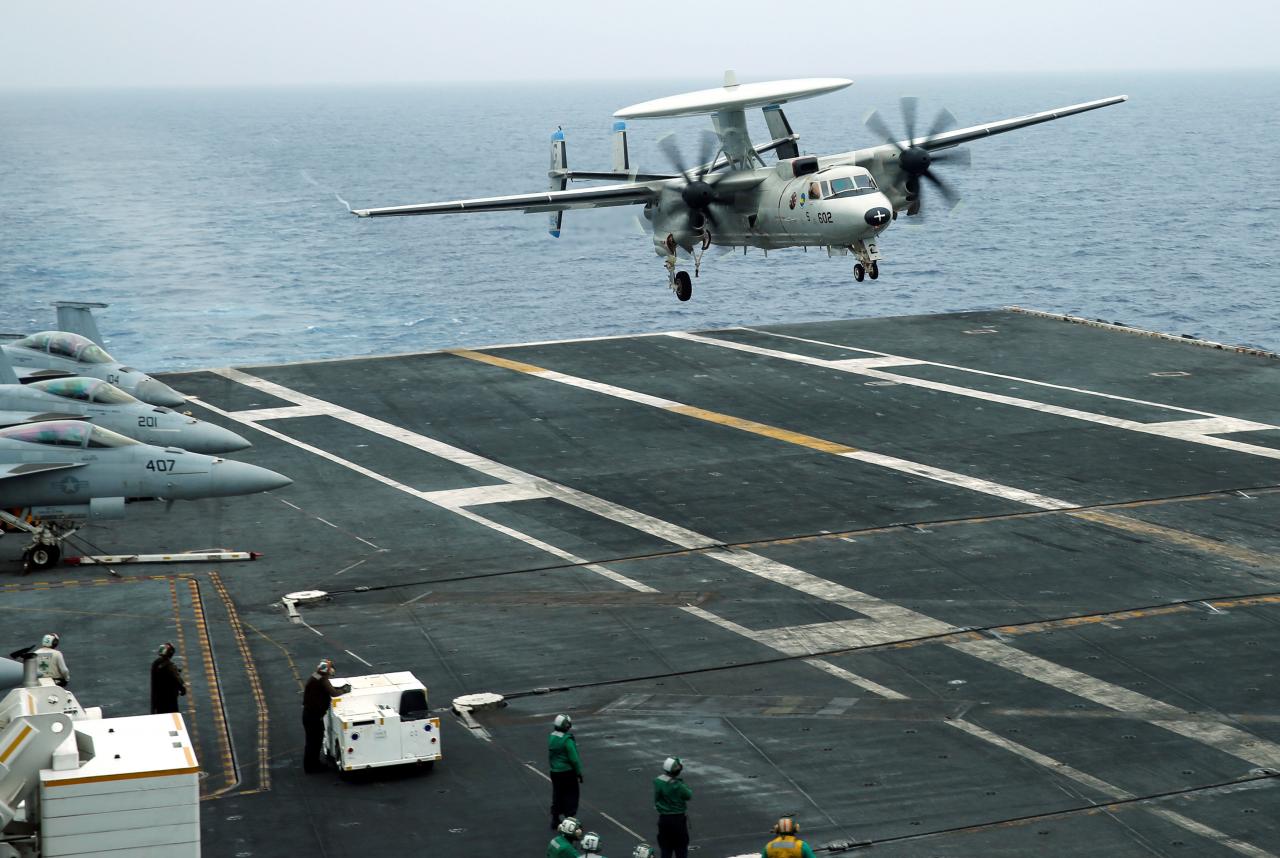 FILE PHOTO: An E-2D Hawkeye plane approaches to the U.S. aircraft carrier John C. Stennis during joint military exercise called Malabar, with the United States, Japan and India participating, off Japan’s southernmost island of Okinaw