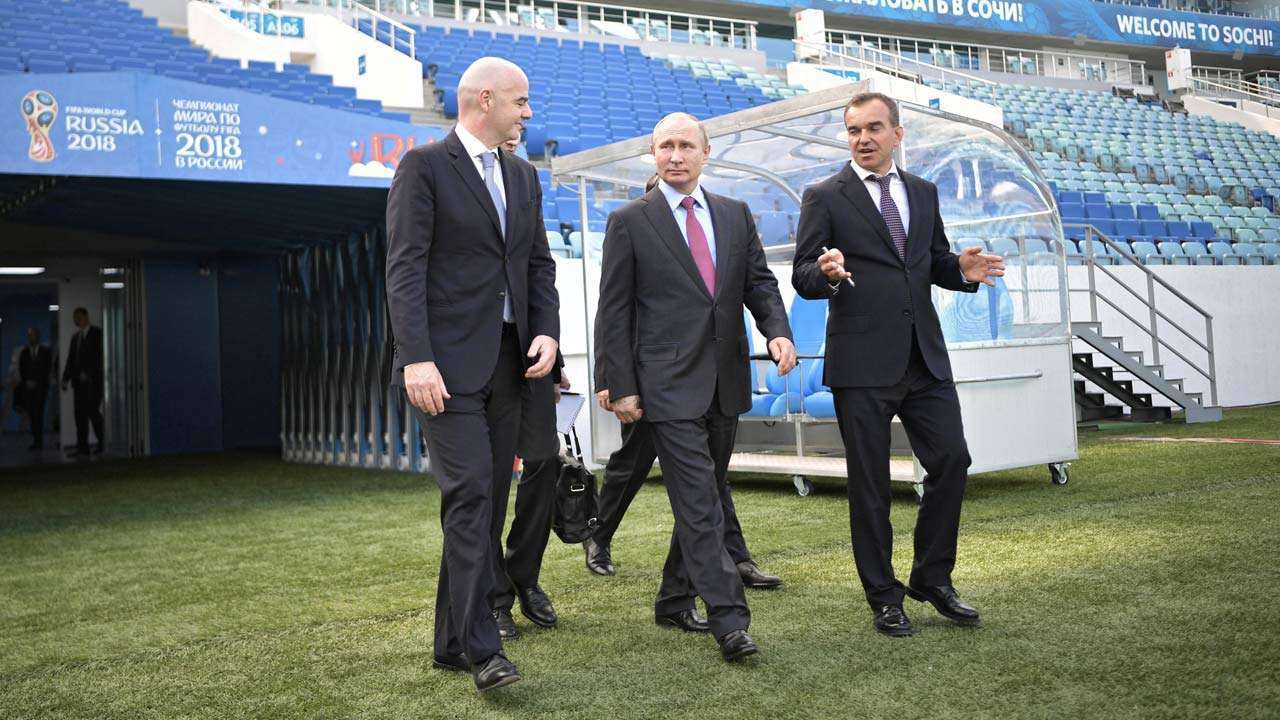 703009-vladimir-putin-gianni-infantino-reuters