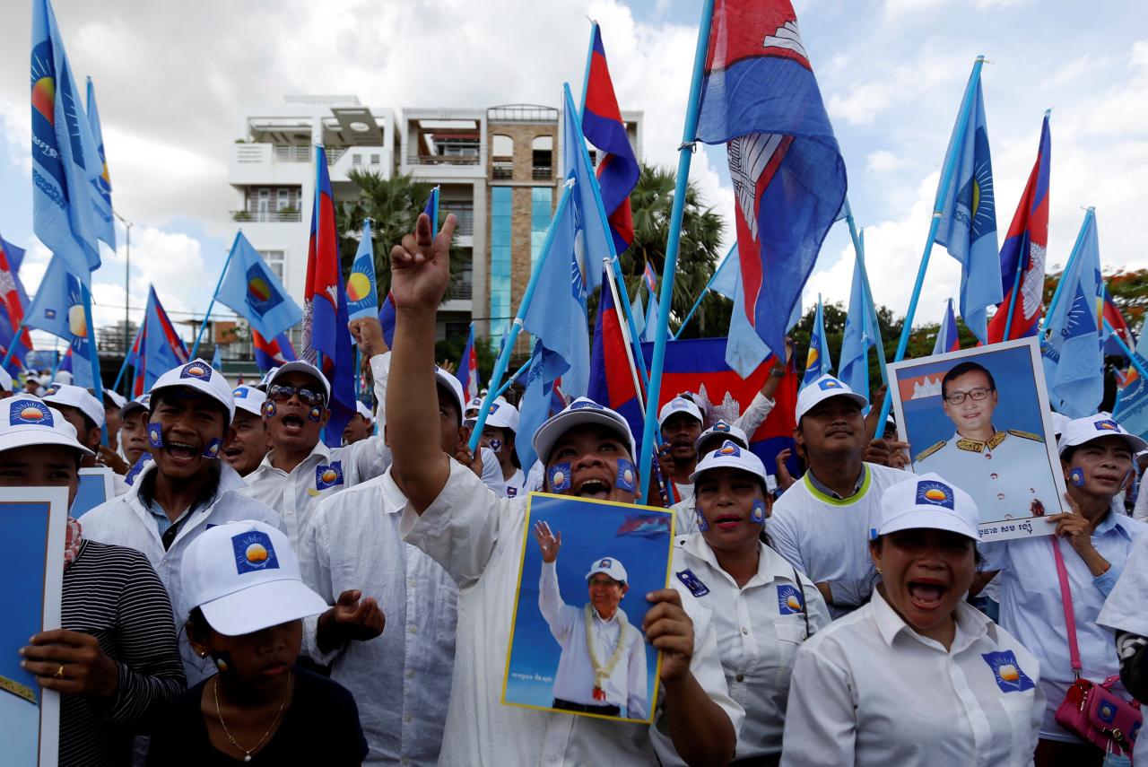 Supporters of President of the opposition Cambodia National Rescue Party attend a campaign rally in Phnom Penh