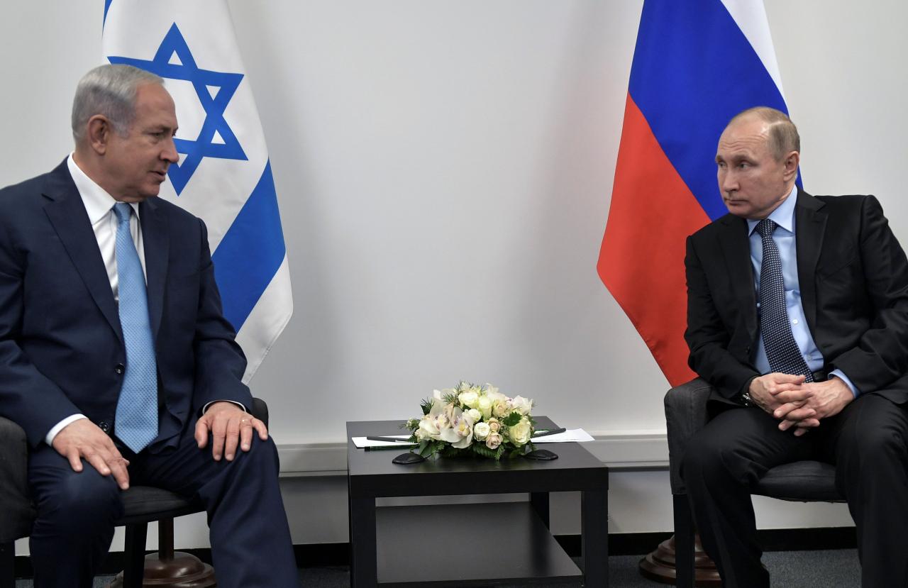 Russian President Putin and Israeli PM Netanyahu attend a meeting at the Jewish Museum and Tolerance Centre in Moscow