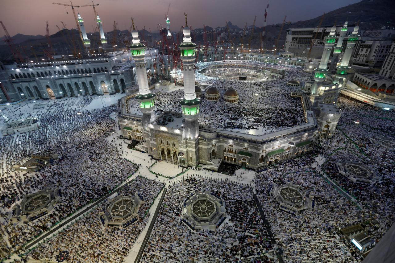 FILE PHOTO: Muslim pilgrims pray around the holy Kaaba at the Grand Mosque, during the annual hajj pilgrimage in Mecca