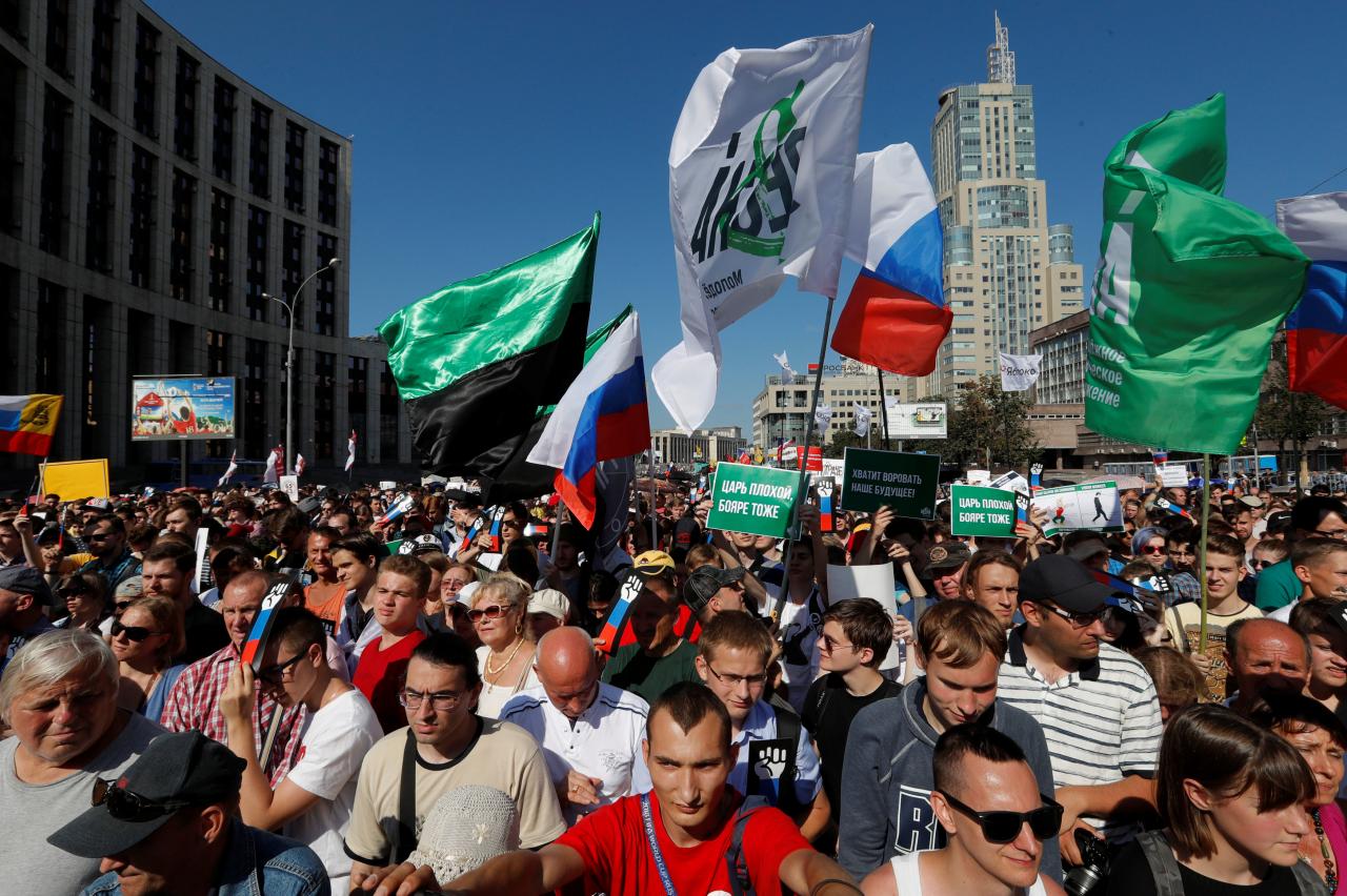 People attend a protest over the government’s decision to increase the retirement age in Moscow