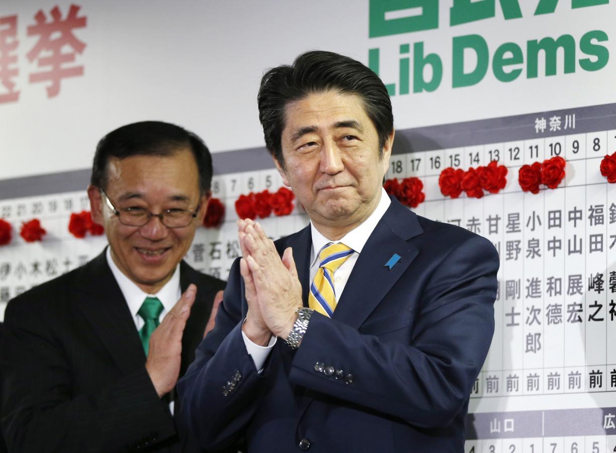 Japan’s Prime Minister Abe claps during an election night event at the LDP headquarters in Tokyo