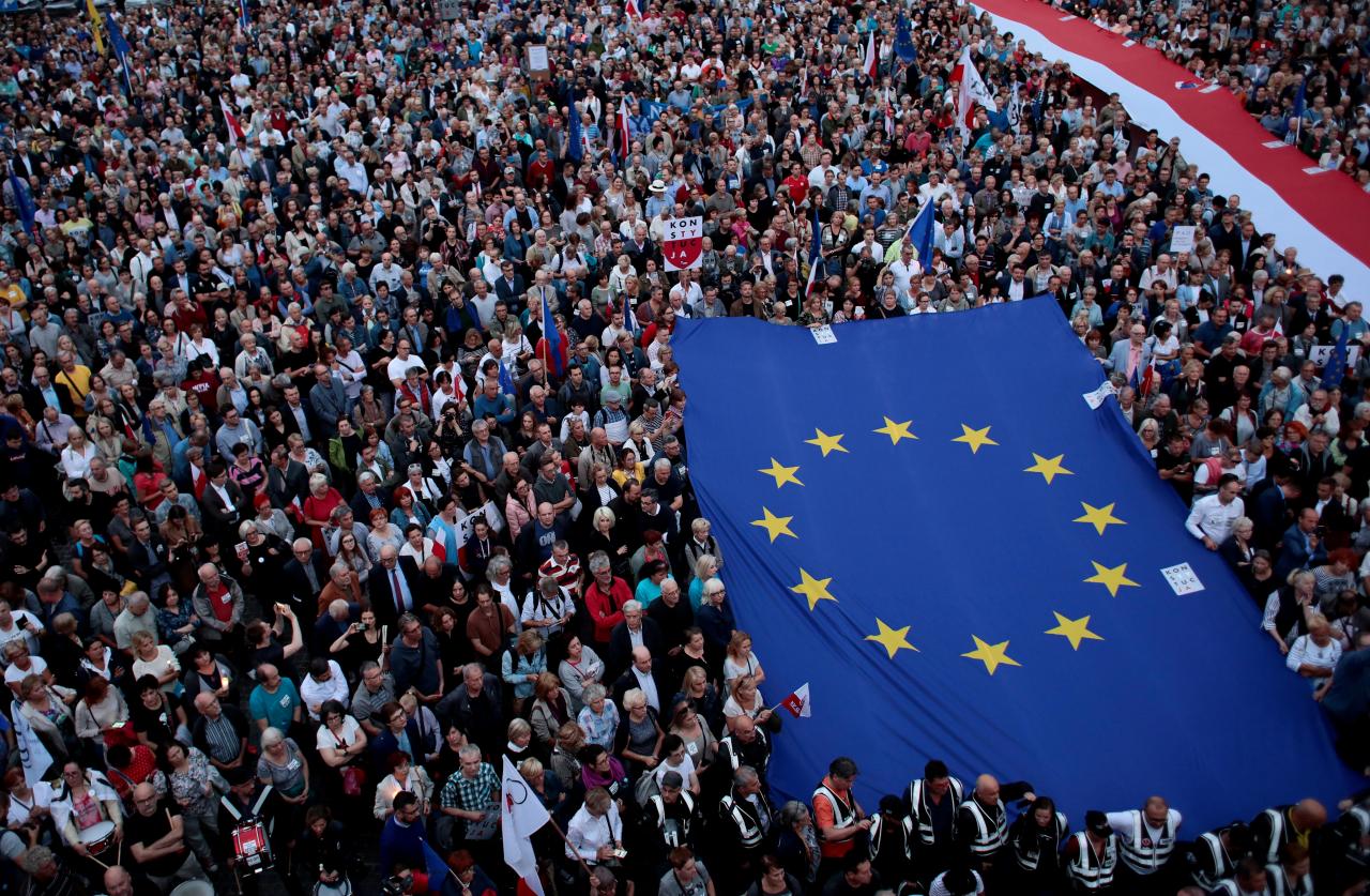 People protest against the conservative government’s makeover of the Polish judiciary in Warsaw