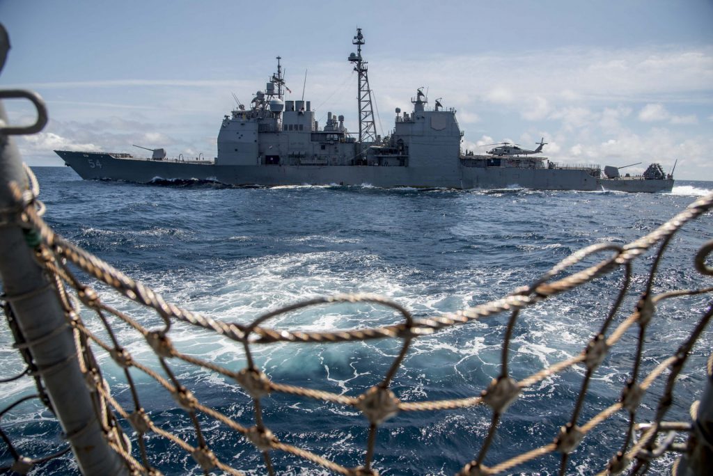 The Ticonderoga-class guided-missile cruiser USS Antietam (CG 54) sails alongside the guided-missile destroyer USS Chung-Hoon (DDG 93).