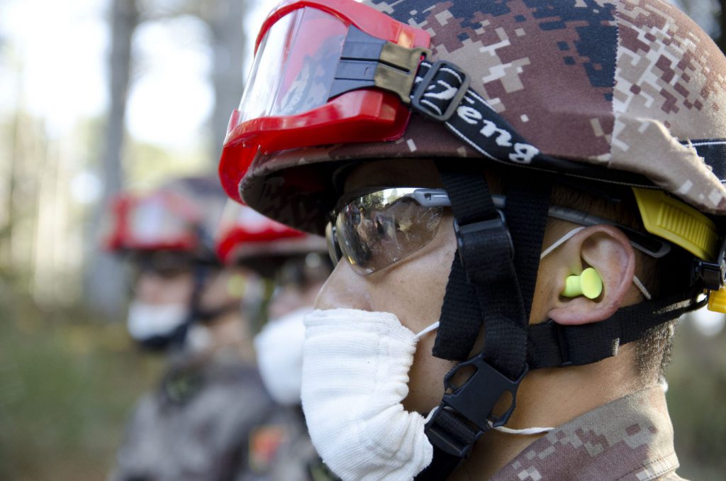 Soldiers from the People’s Liberation Army (PLA) wear masks in preparation to drill through concrete in order to extract simulated casualties from rubble during the 13th annual U.S.-China Disaster Management Exchange at Camp Rilea Armed Forces Training Center, November 18, 2017, in Warrenton, Ore. U.S. Army Pacific hosts the annual exchange with the PLA to foster mutual trust and understanding while sharing lessons learned to increase disaster response in the Pacific region. / New cold war