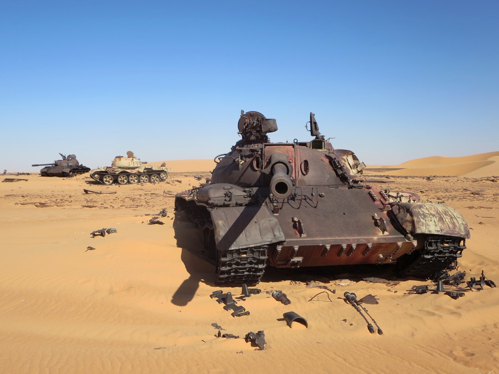 Three Soviet-era T-55 tanks abandoned in the Sahara at Bir Kora are reminders of a Libyan invention in Chad's civil wars which ended badly for Libya in 1987. / Libyan elections
