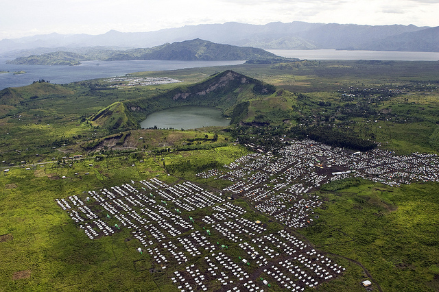 Mugunga I and II (in the foreground) and Bulengo (in the background) camps on the Internally Displaced Persons (IDPs), as seen by the members of a task force comprised of the representatives of the United Nations Organization Mission in the Democratic Republic of the Congo (MONUC), Disarmament Demobilisation, Repatriation, Resettlement and Reintegration (DDRRR) division, Public Information Officers, the World Bank and the government, during a flight to visit the combatants of the Democratic Liberation Forces of Rwanda (FDLR), to encourage them to disarm and repatriate to Rwanda. / Allied Democratic Forces