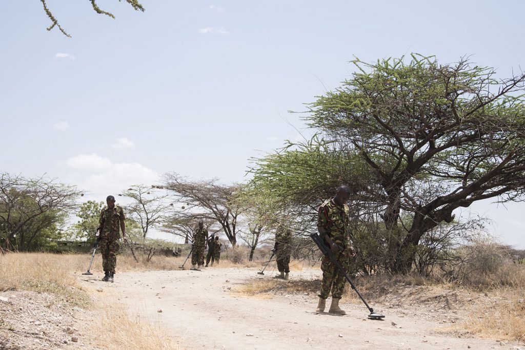 Kenyan Defense Force combat engineers use mine detectors to scan the road for mock-improvised explosive devices during their final portion of tactical combat medical training during Deliberate Kindle 2016, Sept. 15, at a Kenyan training facility. The medical training was just one portion of the four-week course taught by Task Force Sparta, which is currently assigned to Combined Joint Task Force-Horn of Africa. The course was designed to give Humanitarian Mine Action training to course attendees to prepare them for future deployments with the African Union Mission in Somalia. / al-Shabaab recruitment