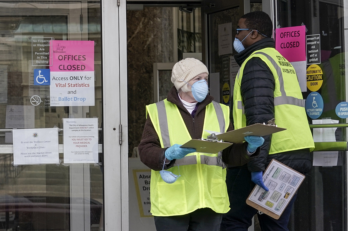 Amid mounting US virus cases, Wisconsin pushes ahead with Democratic