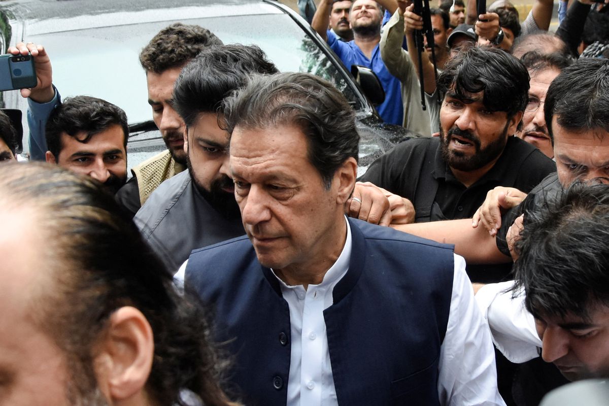 Former Pakistani Prime Minister Imran Khan in a crowd outside of a court.